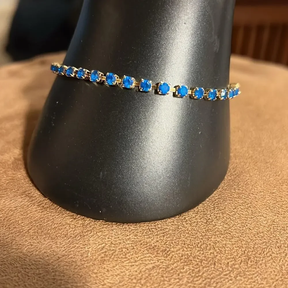 Avon faux sapphire tennis bracelet.